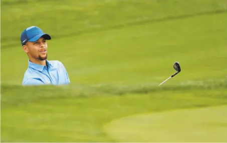  ?? Michael Macor / The Chronicle ?? Stephen Curry watches his bunker shot on the 14th hole at TPC Stonebrae. He got into the event on a sponsor exemption.