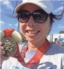  ?? EVE CHEN/USA TODAY ?? It took just over seven hours to earn this 2017 Walt Disney World Marathon medal.