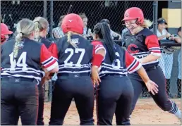  ?? Jeremy Stewart ?? Cedartown’s Marycille Brumby celebrates as she is greeted at home plate by her teammates after hitting a three-run home run in the top of the fifth inning at Rockmart High School last week.