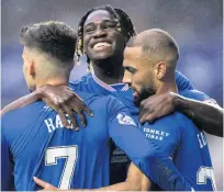  ??  ?? Kemar Roofe (right) celebrates his Rangers goal