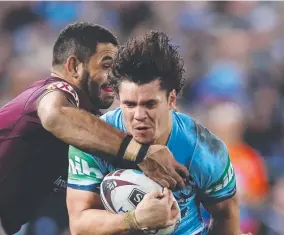  ??  ?? NEW ERA: Blues flyer James Roberts is wrapped up by Greg Inglis.