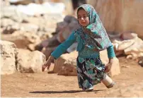  ?? — Reuters, AFP ?? Eight-year-old Maya Meri walks with her new artificial legs at a prosthetic centre in Istanbul, Turkey as earlier Maya (right) was using makeshift legs made by her father from tin cans.