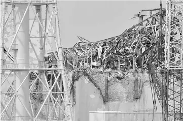  ??  ?? The No. 3 reactor building stands at Tokyo Electric Power Co.’s Fukushima Dai-Ichi nuclear power plant stands in Okuma Town, Fukushima Prefecture, Japan, on May 26, 2012.