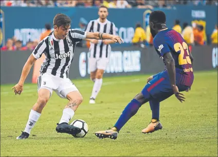  ?? FOTO: MANEL MONTILLA ?? Paulo Dybala, ante Samuel Umtiti en la pasada Champions Al juventino le gustaría ser azulgrana, pero no se hace ilusiones