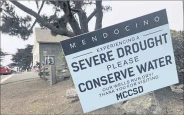  ?? PHOTOS: HAVEN DALEY — THE ASSOCIATED PRESS ?? Signs alert visitors to the drought in Mendocino. Mendocino’s water woes were compounded recently when Fort Bragg — its main backup water supplier — informed officials that it also had a significan­t drop in its drinking water reserves.