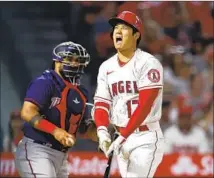  ?? Ronald Martinez Getty Images ?? THE ANGELS’ Shohei Ohtani reacts to a strike call in the sixth inning. He went hitless and struck out twice in the 4-0 loss.