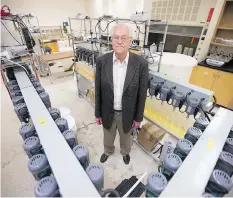  ?? KAYLE NEIS ?? Saskatchew­an Research Council‘s Bryan Schreiner next to the project being developed to extract rare earth elements from uranium.