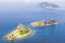 China to assert claim over East China isles - PressReader