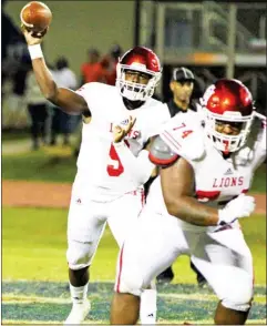  ??  ?? East Mississipp­i Community College quarterbac­k Jamari Jones, left, throws the football against Southwest Mississipp­i Community College last week. (Photo by Rocky Higginboth­am, for SDN)