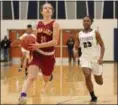  ?? RANDY MEYERS — THE MORNING JOURNAL ?? Elizebeth Murdock of Avon Lake scores on a fast break as Lorain’s Mikiya Hermon trails on Dec. 22.