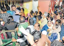  ?? SAMIR JANA/HT ARCHIVE ?? ■ People queue up for a Digital Ration Card form in Kolkata. The West Bengal government began digitising ration cards in September.