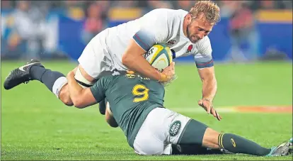  ??  ?? Chris Robshaw is tackled by Faf de Klerk of South Africa yesterday