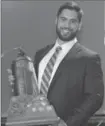  ?? CANADIAN PRESS FILE PHOTO ?? Laurent Duvernay-Tardif of the McGill University Redmen receives the J.P. Metras Trophy as the Outstandin­g Lineman during Vanier Cup celebratio­ns in November 2013 in Quebec City.