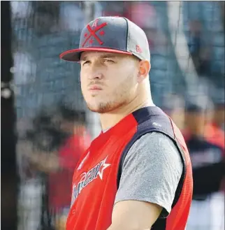  ?? Jason Miller Getty Images ?? IN THE EYES of other players, Angels outfielder Mike Trout plays without a visible weakness. Says Milwaukee catcher Yasmani Grandal: “I feel like he can do pretty much anything he wants.”