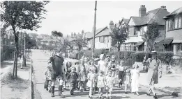  ??  ?? A VJ Day fancy dress parade in a Birmingham suburb 1945