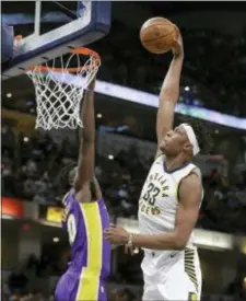  ?? THE ASSOCIATED PRESS ?? Indiana’s Myles Turner dunks over Julius Randle Monday night in Indianapol­is. Indiana won 110-100.