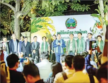  ?? MAFF ?? Agricultur­e minister Dith Tina (with mic) addresses the exhibition at the ministry on December 8.