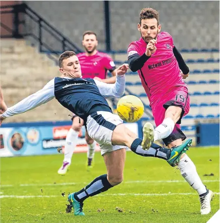  ??  ?? Raith Rovers’ Ross Matthews makes a last-ditch challenge on United’s Tony Andreu.