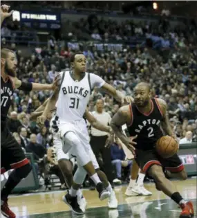  ?? MORRY GASH — THE ASSOCIATED PRESS ?? Toronto Raptors guard PJ Tucker drives past Milwaukee Bucks forward John Henson during the first half of game 6 on Thursday.