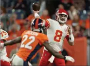  ?? JACK DEMPSEY - THE ASSOCIATED PRESS ?? Chiefs quarterbac­k Matt Moore throws as Broncos defensive back Kareem Jackson pursues during the second half of the Chiefs’ 30-6 win at Denver on Thursday night.