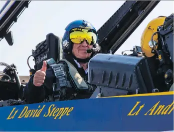  ?? FRANCIS GEORGIAN ?? Postmedia reporter Larry Pynn gives a thumbs-up while inside a Hornet aircraft. Pynn was told that 45 minutes enduring the G-forces of a flight with the Blue Angels can feel like 2.5 hours in the gym.