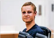  ?? CORNELIUS POPPEN, NTB SCANPIX VIA AP ?? Philip Manshaus, 21, in court in Oslo, Norway, Monday. His lawyer said the suspected shooter “will use his right not to explain himself for now” during his detention hearing.