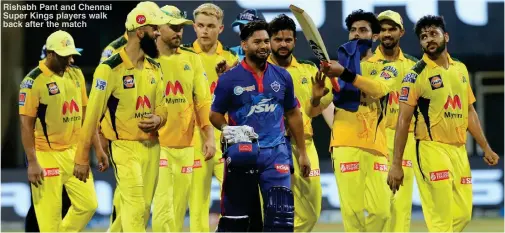  ??  ?? Rishabh Pant and Chennai Super Kings players walk back after the match