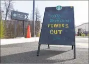  ?? Rich Pedroncell­i Associated Press ?? A SIGN at a Starbucks drive-through in Paradise, Calif., informs customers that the store is closed.