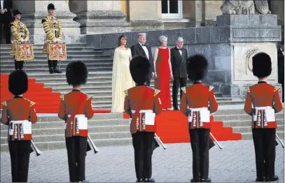  ?? Pablo Martinez Monsivais ?? The Associated Press From left, first lady Melania Trump, President Donald Trump, British Prime Minister Theresa May, and her husband, Philip May, watch the arrival ceremony Thursday at Blenheim Palace, England.