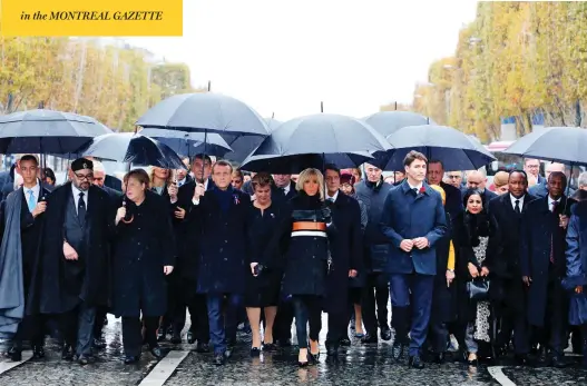  ?? LUDOVIC MARIN / POOL PHOTO VIA AP ?? In Paris Sunday, from left, Morocco’s Prince Moulay Hassan, Moroccan King Mohammed VI, German Chancellor Angela Merkel, French President Emmanuel Macron with wife Brigitte Macron, Prime Minister Justin Trudeau, Niger’s First Lady Lalla Malika Issoufou, President of Niger Mahamadou Issoufou and Republic of Guinea President Alpha Condé.