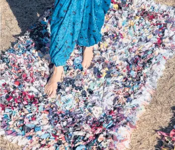  ?? KARSTEN MORAN/THE NEWYORKTIM­ES ?? Artist and author Leanne Shapton stands on one of her rugs made from old clothing.