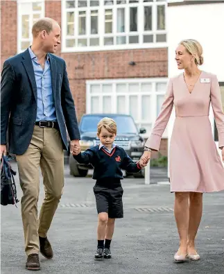  ?? PHOTO: REUTERS ?? Helen Haslem, head of the lower school, and Prince William hold Prince George’s hands as he arrives for his first day of school at Thomas’s school in Battersea, London.