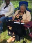  ?? KATHLEEN CAREY - DIGITAL FIRST MEDIA ?? Susie Carter, 88, sister of Alexander McClay Williams sings in honor of her brother as the family lays a marker on his grave Saturday.