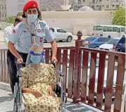  ?? (Supplied photo) ?? An Omani Scout wheels in a senior resident for vaccinatio­n