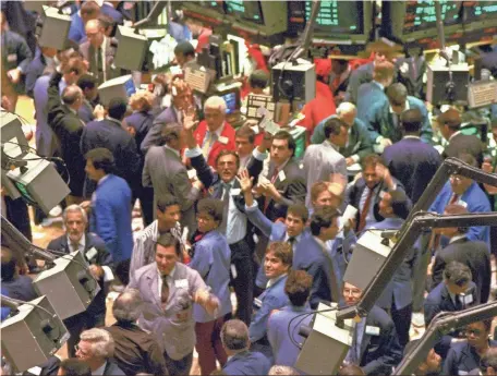  ?? PETER MORGAN, AP ?? Traders on the New York Stock Exchange are frenzied Oct. 19, 1987, as the Dow plunges.