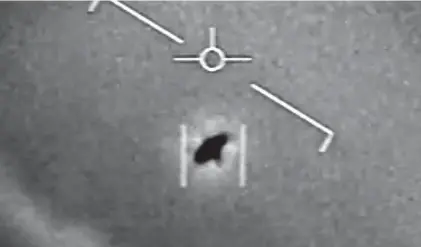  ?? DEPARTMENT OF DEFENSE ?? A still image shows an unidentifi­ed aerial phenomena captured by a Navy pilot and authentica­ted by the Department of Defense. A Pentagon report released Friday has found no evidence that the U.S. government is hiding informatio­n about extraterre­strial visits.