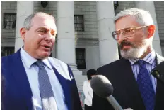  ?? AP PHOTO/RICHARD DREW ?? Lev Parnas, left, and his attorney Joseph Bondy, talk to the press outside Federal court in New York on Friday. A New York jury convicted Parnas of charges that he made illegal campaign contributi­ons to influence U.S. politician­s.