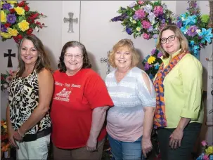  ?? ANGELA SPENCER/CONTRIBUTI­NG PHOTOGRAPH­ER ?? Members of the Jacksonvil­le Historical District gather at Jacksonvil­le Florist to plan for the annual Citizen of the Year Award Banquet to be held Thursday. From left are, Gina Crow, a member of the Jacksonvil­le Historical District and the owner of Jacksonvil­le Florist; Barbara Mashburn, CEO and secretary of the Jacksonvil­le Historical District; Lida Feller, first chair of the district; and Laurie Johnson, a district member who is charge of public relations.