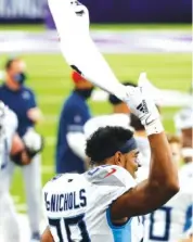  ??  ?? Tennessee Titans running back Jeremy McNichols (28) celebrates the team’s win over the Minnesota Vikings on Sunday.