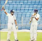  ?? PTI ?? Gautam Gambhir (left) after reaching his century during Delhi’s Ranji Trophy semifinal against Bengal, in Pune on Monday.