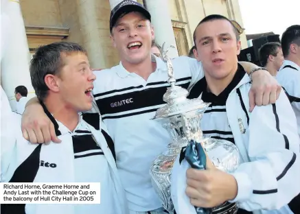  ??  ?? Richard Horne, Graeme Horne and Andy Last with the Challenge Cup on the balcony of Hull City Hall in 2005