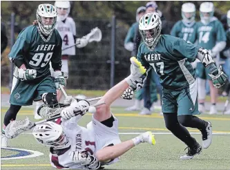  ?? CLIFFORD SKARSTEDT EXAMINER ?? Trent Excalibur's Jeffrey Fernandes levels Ottawa Gee Gees' Kyle Stavely n the opening playoff round of the Canadian University Field Lacrosse Associatio­n on Saturday at Trent University's Justin Chiu Stadium.