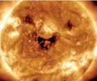  ?? ?? NASA’s Solar Dynamics Observator­y has caught the sun “smiling”.