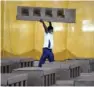  ?? (AFP) ?? A photo shows a worker carrying a cardboard bed inside the campus hall of RSSB which is being converted into a 10,000 beds COVID-19 coronaviru­s care centre in New Delhi.