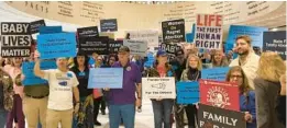  ?? TWITTER.COM ?? Peaceful protesters on both sides of the abortion issue in the rotunda of the state Capitol.