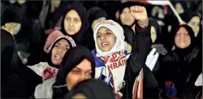  ??  ?? Protesters shout anti-government slogans as they participat­e in a week-long sit-in in Budaiya west of Manama this week. Reuters