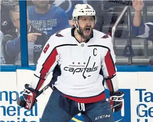  ?? JASON BEHNKEN/THE ASSOCIATED PRESS ?? The Caps’ Alex Ovechkin celebrates his first-period goal against Tampa in Game 7 Wednesday.