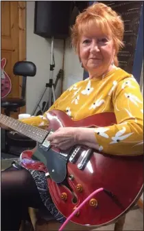  ??  ?? Happy to hang up: Guitarist Janet Littlewood