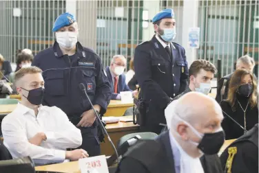  ?? Gregorio Borgia / Associated Press ?? Finnegan Lee Elder (left) and codefendan­t Gabriel NataleHjor­th (right) sit before a Rome jury that found them guilty in the slaying of an Italian plaincloth­es police officer in 2019 in Rome.