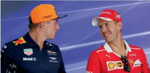  ?? AP ?? Max Verstappen (left) chats with Sebastian Vettel during a press conference in Sepang. —